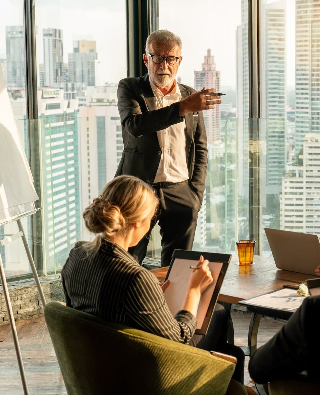 Senior executive leading a meeting